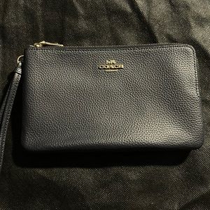 Gently used Coach double sided navy blue wallet.
